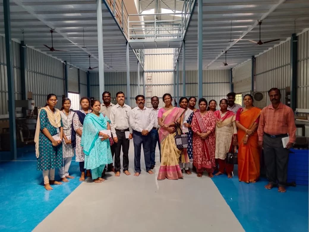 A group photographed inside the MiracleTree facility